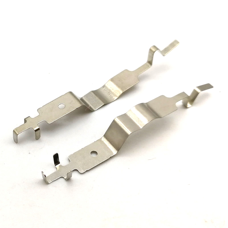 How do progressive dies improve efficiency in mass production of stamped small parts
